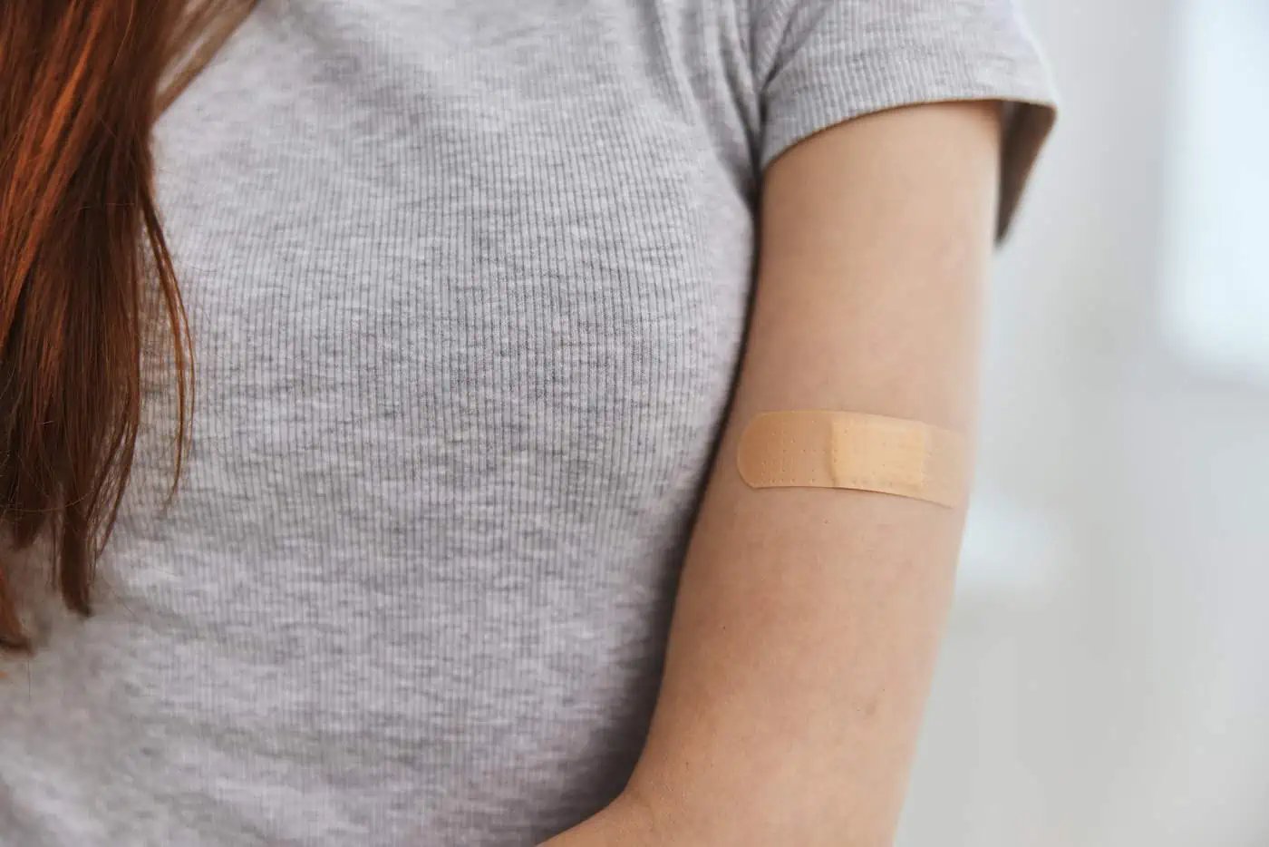 woman-with-adhesive-plaster-on-shoulder-vaccine-pa-2023-12-11-16-45-36-utc_1